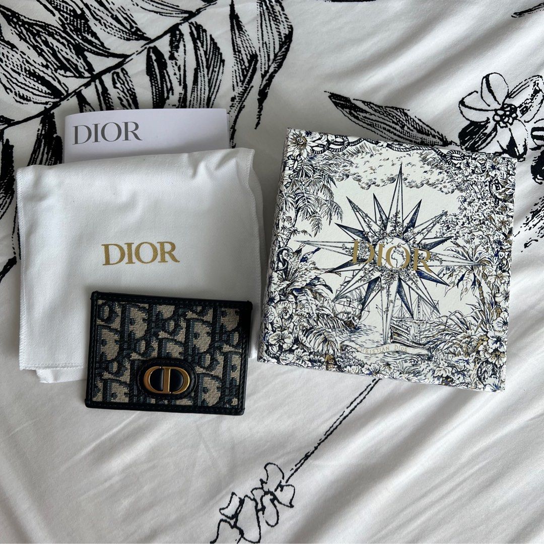 DIOR 30 Montaigne S Cardholder (Category: Luxury Bags & Wallets) located in San Juan City. Submitted by coveted87 (Listing ID 1251113827, Image 2). Description: -guaranteed authentic -comes with dustbag, box and receipt -with minor scratches due to use -bought from Dior Greenbelt last May 2022 -bpi/gcash -grab/lbc from san juan mmla.