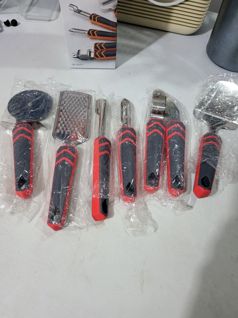 Kitchen gadget set (Category: Other Kitchenware & Tableware) located in Makati City. Submitted by thedeclutteringabuela (Listing ID 1251263638, Image 1). Description: 6 pc kitchen gadget consisting of garlic presser,peeler,cheese slicer,pizza cutter fruit coret and grater..