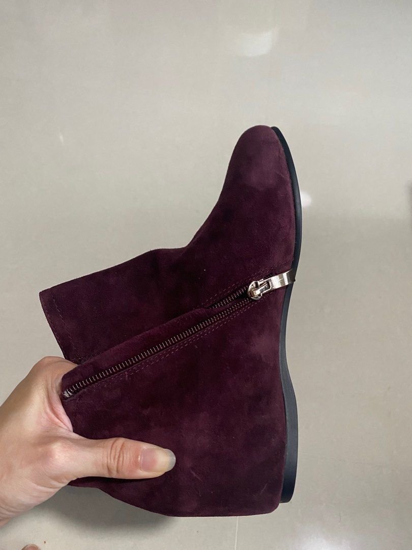 Maroon boots elevated platform inside