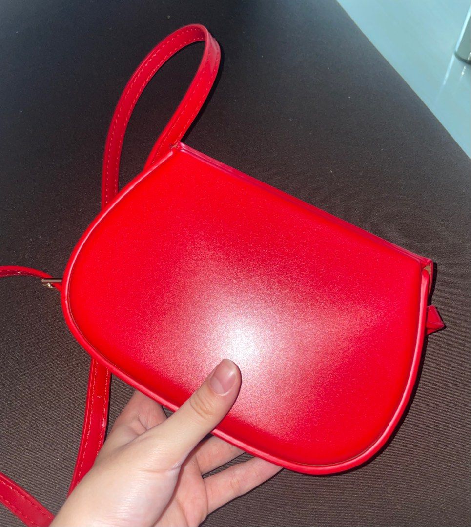 Red mini crossbody shoulder leather sling bag (Category: Shoulder Bags) located in Paranaque City. Submitted by shopowned (Listing ID 1251161518, Image 3). Description: barely used bought for 300 rfs: too small for me slightly negotiable added a small hole on the strap bc i wanted to make it a shoulder bag but it’s barely noticeable (last 2 pics) MOP GCASH MOD LALAMOVE OR GGX.