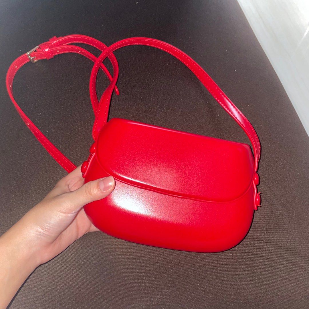 Red mini crossbody shoulder leather sling bag (Category: Shoulder Bags) located in Paranaque City. Submitted by shopowned (Listing ID 1251161518, Image 1). Description: barely used bought for 300 rfs: too small for me slightly negotiable added a small hole on the strap bc i wanted to make it a shoulder bag but it’s barely noticeable (last 2 pics) MOP GCASH MOD LALAMOVE OR GGX.