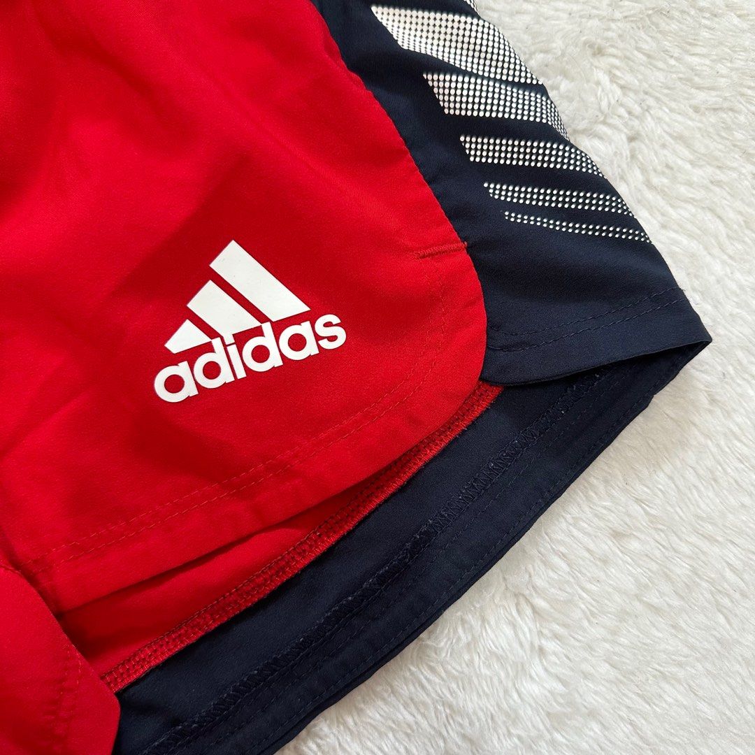 Red and white running shorts top