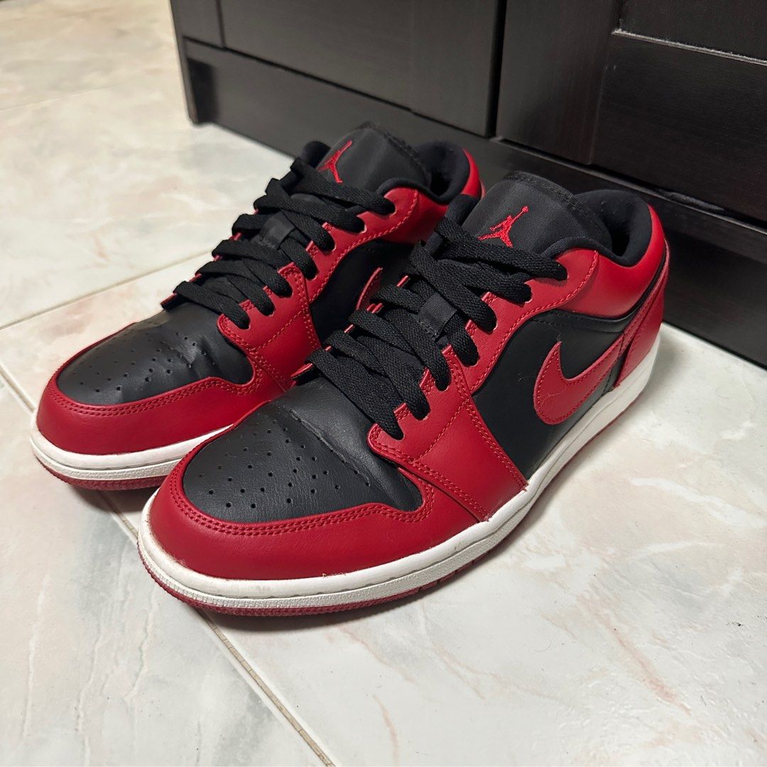 Red and black jordans low top top