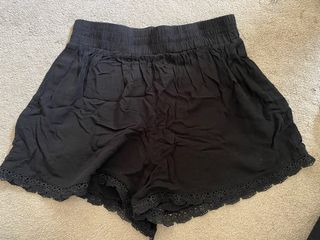 Black flowy shorts with lace trim