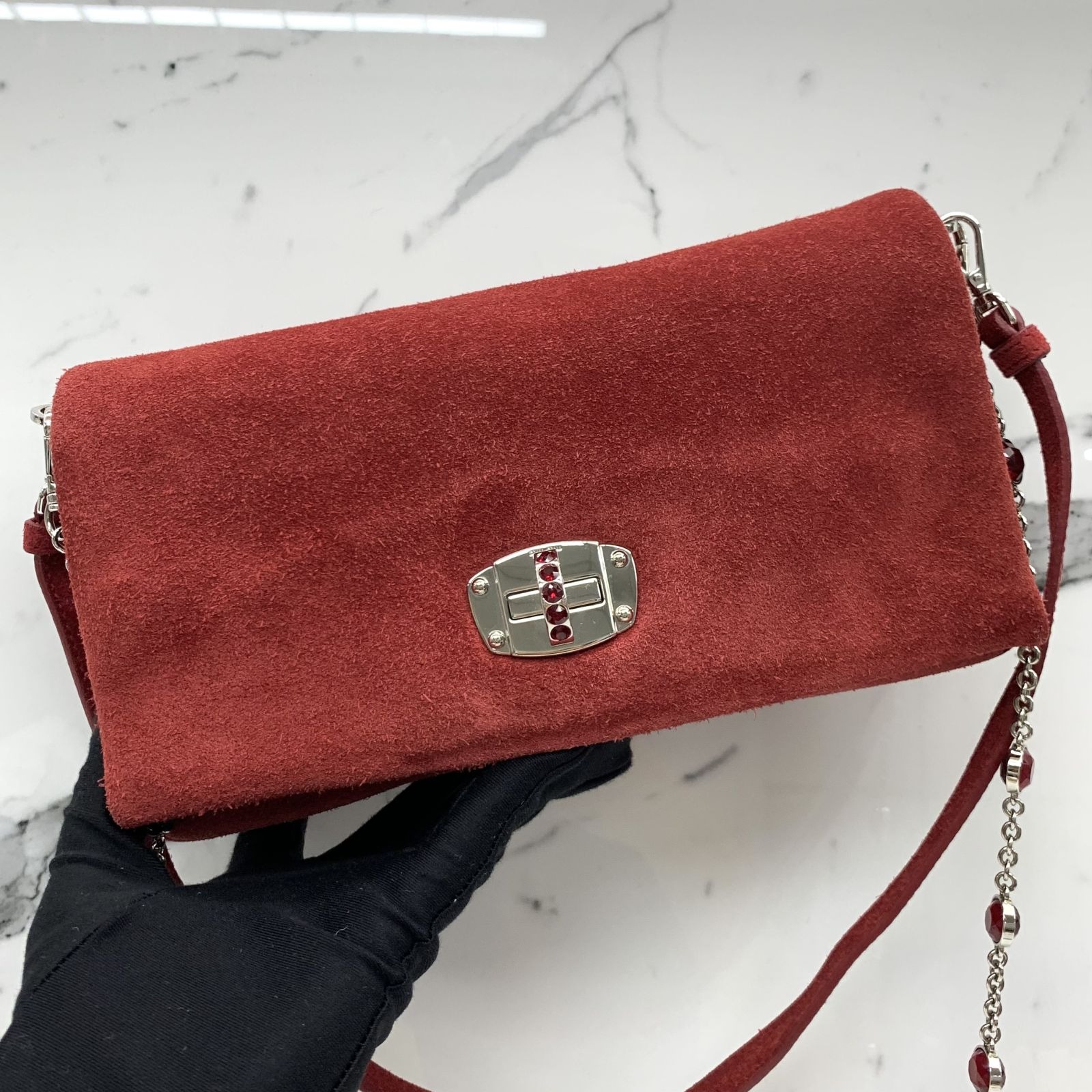 Red suede shop clutch bag