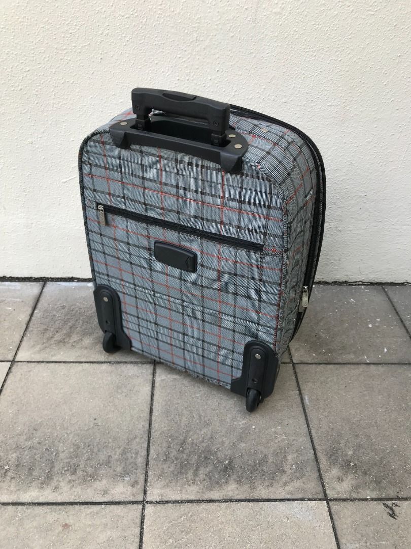 Bentley 21 inches expandable luggage. All zippers and wheels are