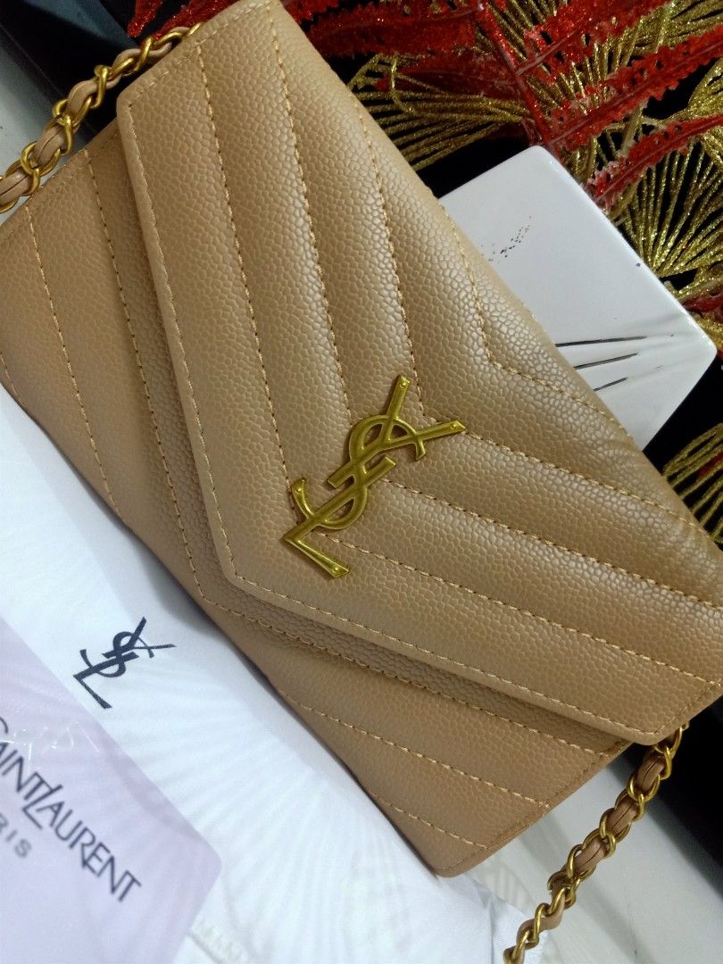 Japan Preloved YSL Sling wallet (Category: Luxury Bags & Wallets) located in Cebu City. Submitted by day.98 (Listing ID 1251543285, Image 2). Description: selected from japan surplus caviar lesther genuine leather coded& etikita no flaws with box & dust bag.
