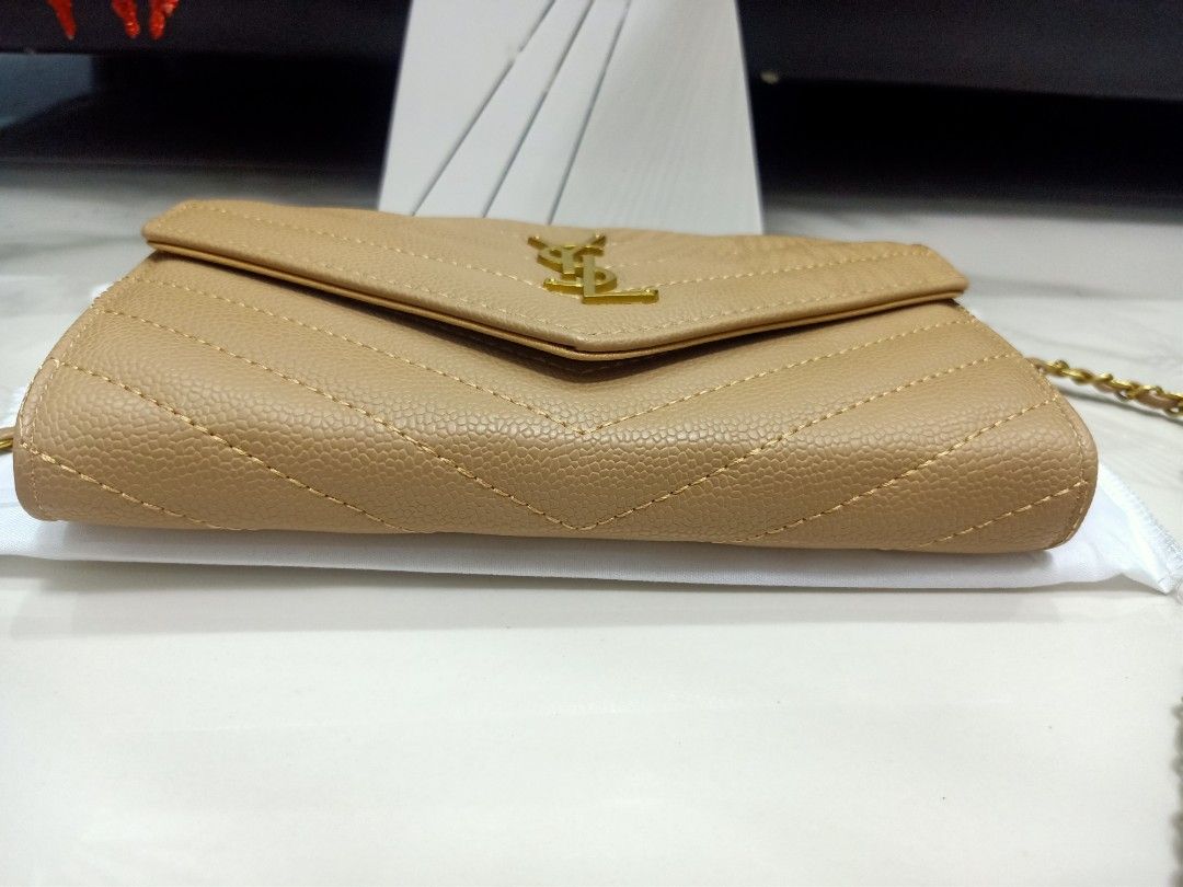 Japan Preloved YSL Sling wallet (Category: Luxury Bags & Wallets) located in Cebu City. Submitted by day.98 (Listing ID 1251543285, Image 3). Description: selected from japan surplus caviar lesther genuine leather coded& etikita no flaws with box & dust bag.