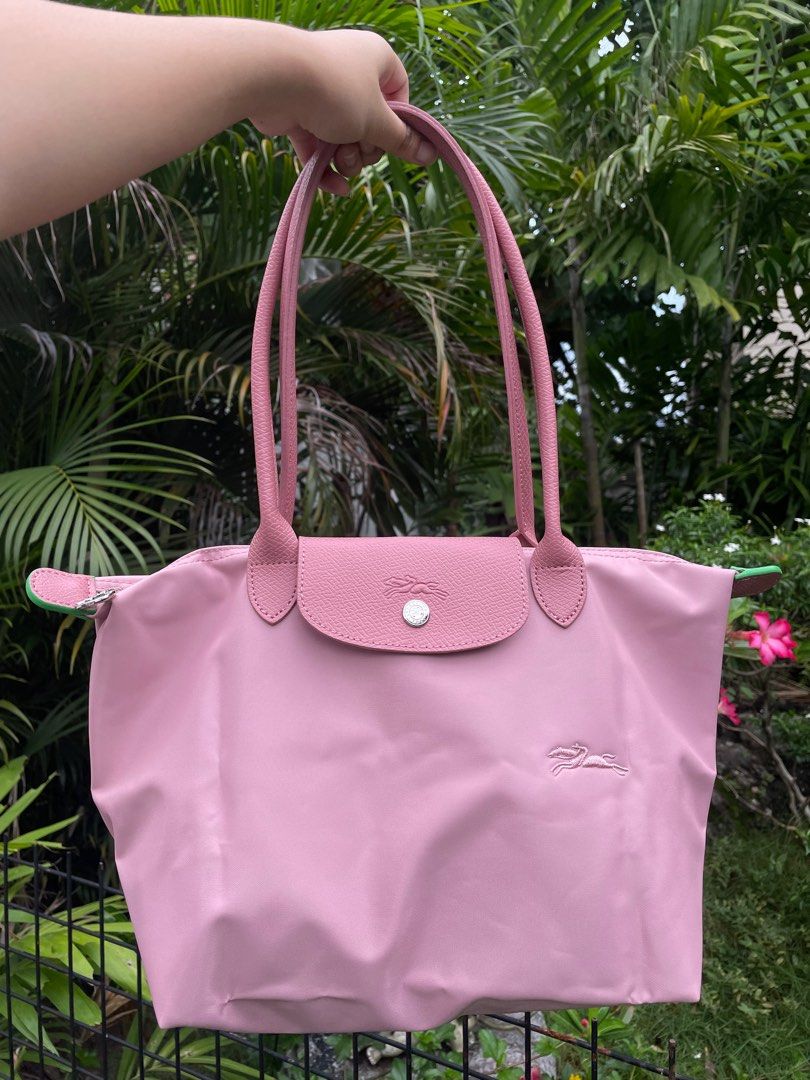 RESTOCKED Longchamp Le Pliage in Petal Pink (M) (Category: Luxury Bags & Wallets) located in Cebu City. Submitted by everythingestetik (Listing ID 1249526721, Image 1). Description: Very cute and handy! Can fit a lot of stuff. Perfect if you’re always on the go! 💗 Selected from Japan outlet/surplus shop With care card and tag In very good brand new condition.