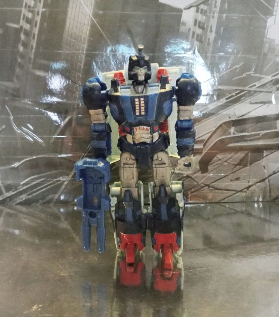 Transformers : Titans Return - Devcon (custom) (Category: Toy Figures) located in Singapore. Submitted by slammerisunless (Listing ID 1251624056, Image 1). Description: I'm about to sell this custom figure of Devcon because this was made back around 2020 as back when they still didn't redo the figure of our beloved Autobot Bounty Hunter, and now they did make the figure of Devcon as part of TF LEGACY. This figure of Devcon is basically what I use