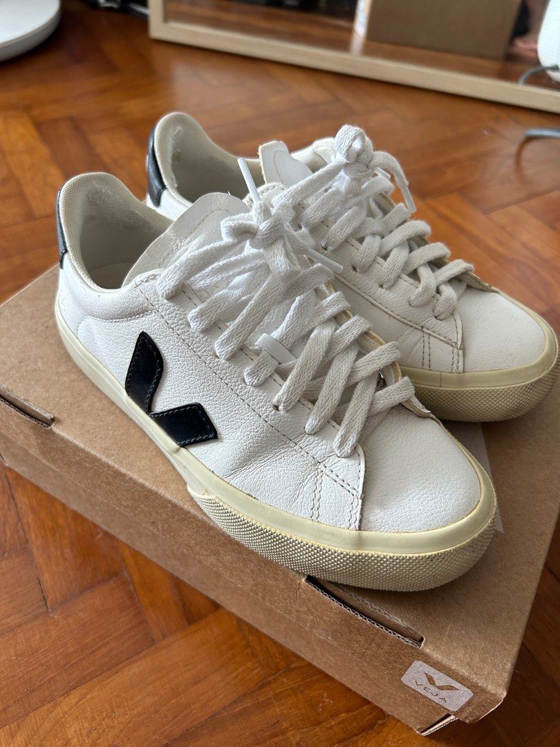 White sneakers with new arrivals v logo