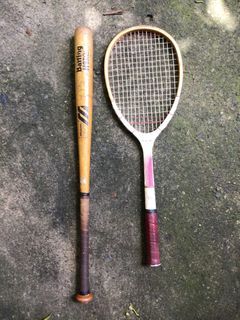 Vintage tennis racket and baseball bat wooden