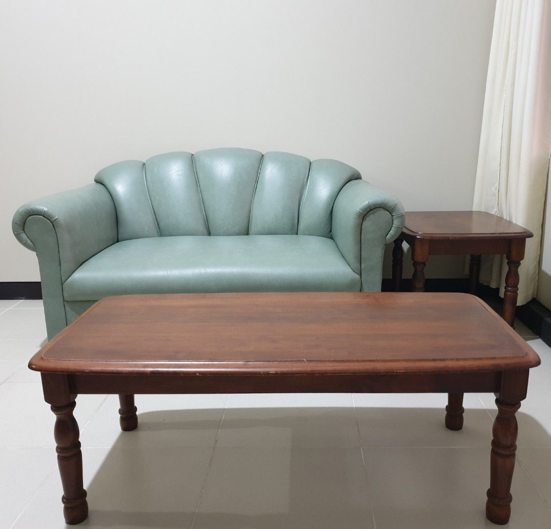 Blims Fine Furniture Sofa Set (Category: Sofas) located in Makati City. Submitted by fifth_avenue_shop_mnl (Listing ID 1251758027, Image 2). Description: 2 sets of 2 seater green leather sofa set with dark wood center/coffee table and side table. Dimensions: Sofa (b): 57.5" (54") L × 30.1" W × 30.5" H Sofa (s): 49.7" (47.7") L × 28.9" W × 20.9" H Coffee table: 42.5" L × 21.3" W × 15.9" H Side table: 24.5" L × 20.2" W × 18" H The payment of the pu