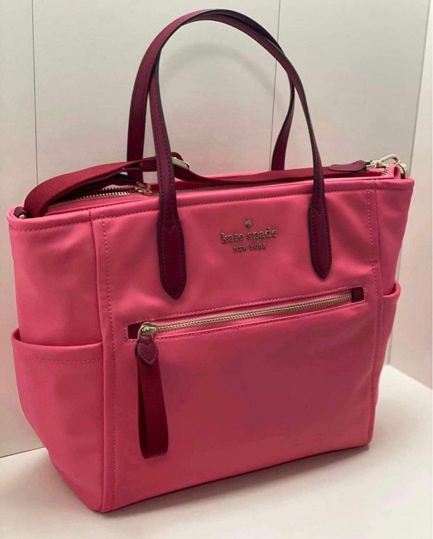 Kate Spade Chelsea Medium Pink (Category: Luxury Bags & Wallets) located in Batangas. Submitted by ellepicks (Listing ID 1251762662, Image 1). Description: 9”H x 10.5”L x 5”D Handle drop: 6” Drop: 22” Polyester Two way spade jacquard lining Smooth leather trim Flaw: Damaged stitch (Message for pic) Used only twice, in office Kate Spade Chelsea Medium Top Zip Satchel Crossbody Nylon.