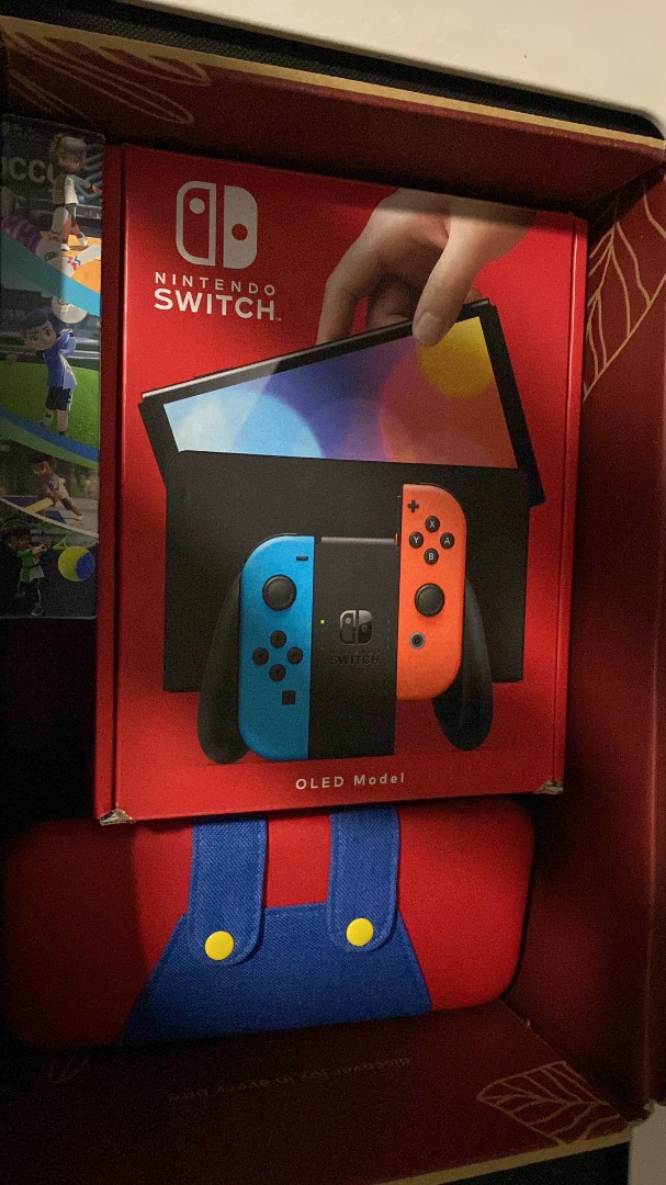Nintedo Switch OLED console + 2 Games - Warranty still intact until ...