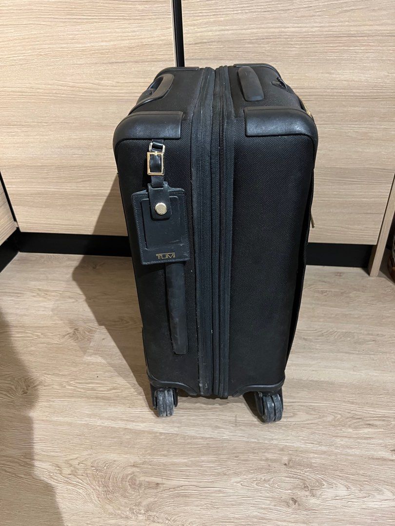 Tumi black hotsell and gold luggage
