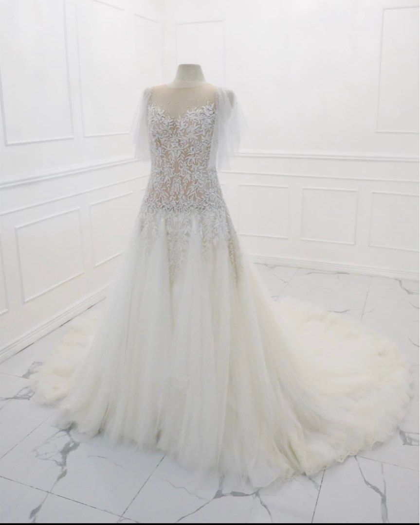 Wedding gown (Category: Evening dresses & gowns) located in Paranaque City. Submitted by jenchumann (Listing ID 1251688166, Image 1). Description: Custom made embroidered and embelishments by Ingrid Santillan Atelier for 75k. Dry cleaned already. .