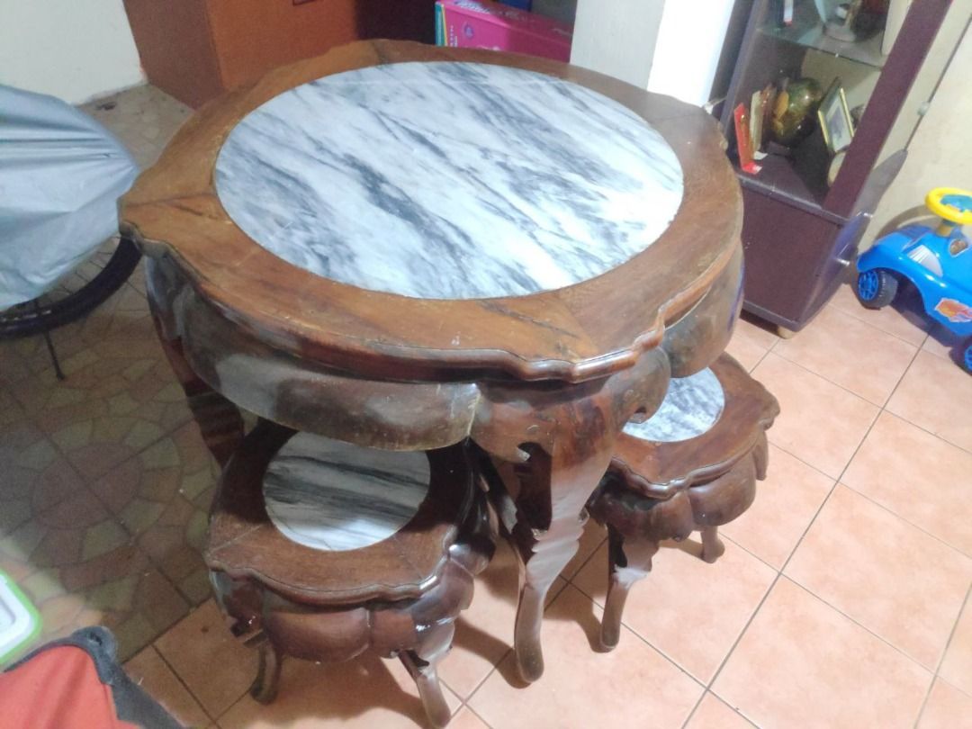 Rosewood Round Tea Table with stools (Category: Tables & Sets) located in Las Pinas. Submitted by daryl.m. (Listing ID 1246804491, Image 1). Description: Chinese carved rosewood tea table w/ 4 stools. Please Note Minor sign of usage but still presentable.