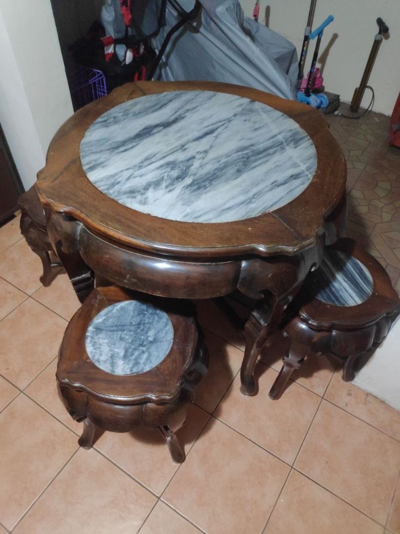Rosewood Round Tea Table with stools (Category: Tables & Sets) located in Las Pinas. Submitted by daryl.m. (Listing ID 1246804491, Image 3). Description: Chinese carved rosewood tea table w/ 4 stools. Please Note Minor sign of usage but still presentable.