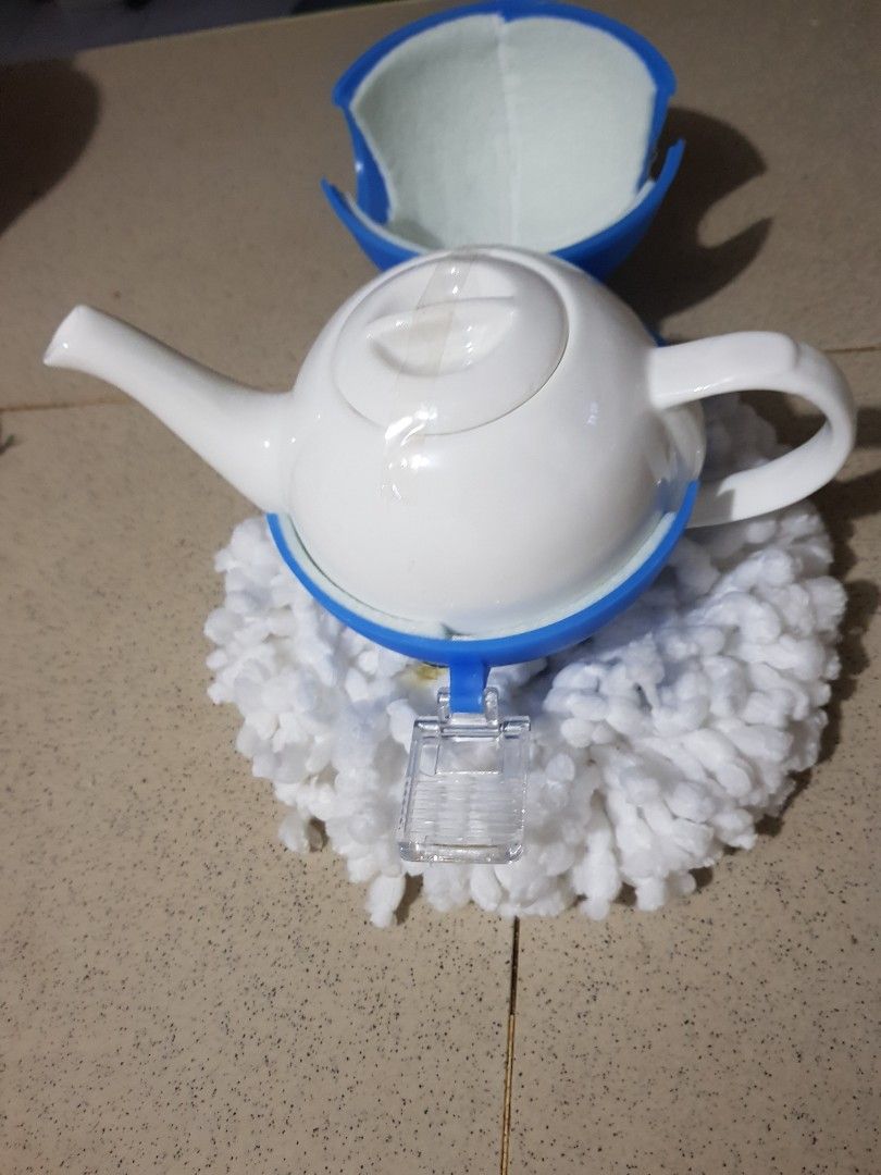 White ceramic tea pot with insulated dome cover (Category: Coffee & Tea Tableware) located in Quezon City. Submitted by zeyanne (Listing ID 1246791575, Image 3). Description: bought abroad but not used. no box decluttering no issues.