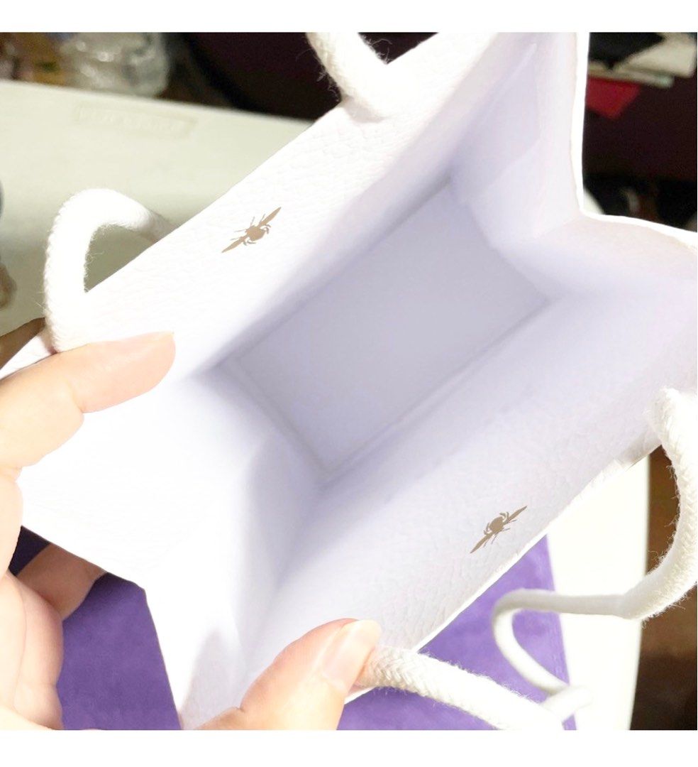 AUTHENTIC Dior plain white paper bag paperbag gift bag (Category: Makeup) located in Pasig City. Submitted by vanityboutique (Listing ID 1251943669, Image 3). Description: AUTHENTIC Dior plain white paper bag paperbag gift bag Pm for more details super spacious you can put several things inside approximately 9 inches by 6 inches Brand new and authentic Selling low and affordable One of the best selling brands in the makeup skincare perfume world 