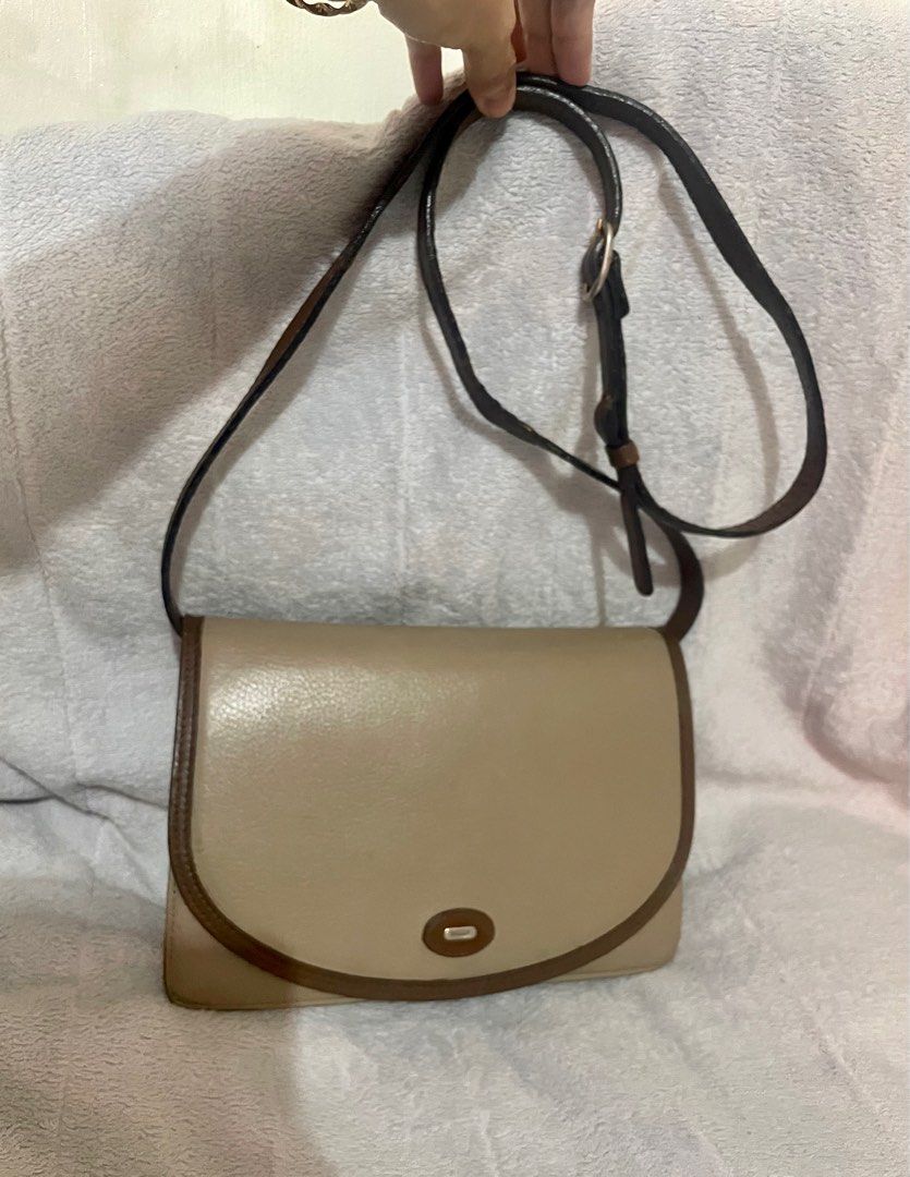 Authentic BALLY beige sling bag (Category: Luxury Bags & Wallets) located in San Pablo. Submitted by prelovedbymistyblue (Listing ID 1251889645, Image 1). Description: Authentic vintage Bally leather shoulder/crossbody bag. No major flaws except signs of use on the sling and leather. With minimal rubs on the inner leather. Has 3 compartments. Lampo zip pocket. Adjustable sling. Selling low for 2400, then 1900, 1700, then 1500. .