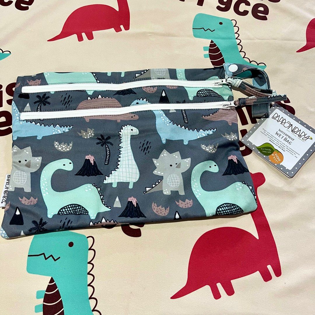 BAPRON Dinosaur Drawing - Waterproof Wet Bag (Category: Weaning & Toddler Feeding) located in Paranaque City. Submitted by ecarhg29 (Listing ID 1251901841, Image 3). Description: BAPRON Dinosaur Drawing - Waterproof Wet Bag Brand new | Php1000 RFS: Extra SRP: ₱1,300 / $22.99 Newest addition to the BapronBaby product line is a super soft zippered pouch with two compartments for separated wet/dry storage. The Waterproof Wet Bag is made with love to