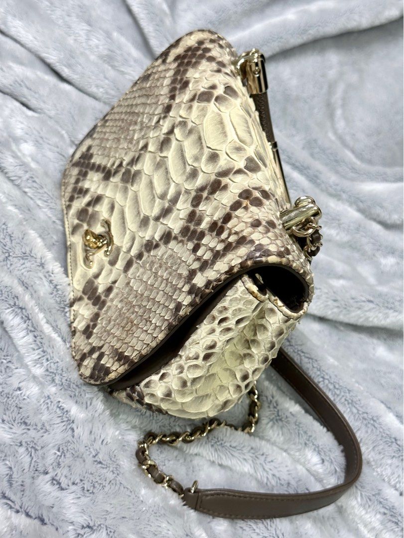 CHANEL Authentic Python Leather Cream/Brown CC Carry Chic Flap Bag “RARE” (Category: Luxury Bags & Wallets) located in Dasmarinas. Submitted by luxuryl (Listing ID 1248082659, Image 3). Description: •CHANEL •Authentic CHANEL Cream/Brown Python Leather CC Carry Chic Flap Bag “RARE” Crafted from Genuine Neutral Python Skin. Intact Hologram RARE❗️❗️❗️ (PRELOVED) Good Condition 9.5/10 NEGOTIABLE ❗️ Open for meet up or shipping ! You can check everyth