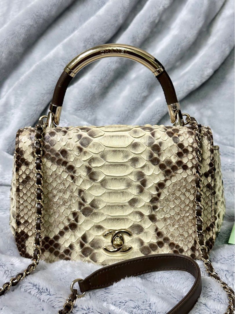 CHANEL Authentic Python Leather Cream/Brown CC Carry Chic Flap Bag “RARE” (Category: Luxury Bags & Wallets) located in Dasmarinas. Submitted by luxuryl (Listing ID 1248082659, Image 2). Description: •CHANEL •Authentic CHANEL Cream/Brown Python Leather CC Carry Chic Flap Bag “RARE” Crafted from Genuine Neutral Python Skin. Intact Hologram RARE❗️❗️❗️ (PRELOVED) Good Condition 9.5/10 NEGOTIABLE ❗️ Open for meet up or shipping ! You can check everyth