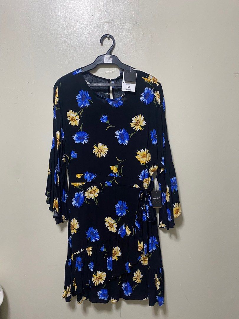 Floral midi dress (Category: Dresses) located in Quezon City. Submitted by fideetamore (Listing ID 1251943870, Image 2). Description: Floral f21 dress Size medium Brand new never worn as seen in tag.