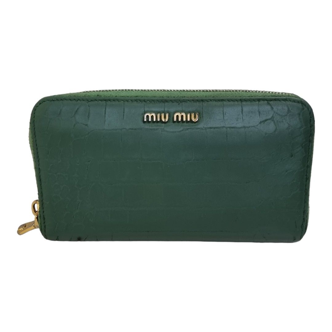 Authentic MIU-MIU Zippy wallet compact (Category: Luxury Bags & Wallets) located in Quezon City. Submitted by manerarestorationservices (Listing ID 1252109281, Image 1). Description: SALE SALE SALE❗❗❗ Money back Guarantee 💯% Guaranteed authentic *Brand: MIU MIU Bby prada zippy commpact wallet *Materials: croc skin embossed *Color: green *Size: long *Condition: 8/10 exterior has been touch up -Used * Inclusions: wallet only Rank review by the cri