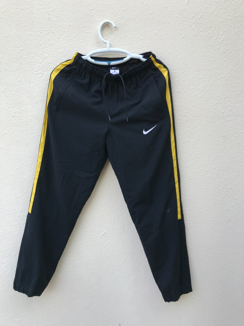 yellow nike track pants