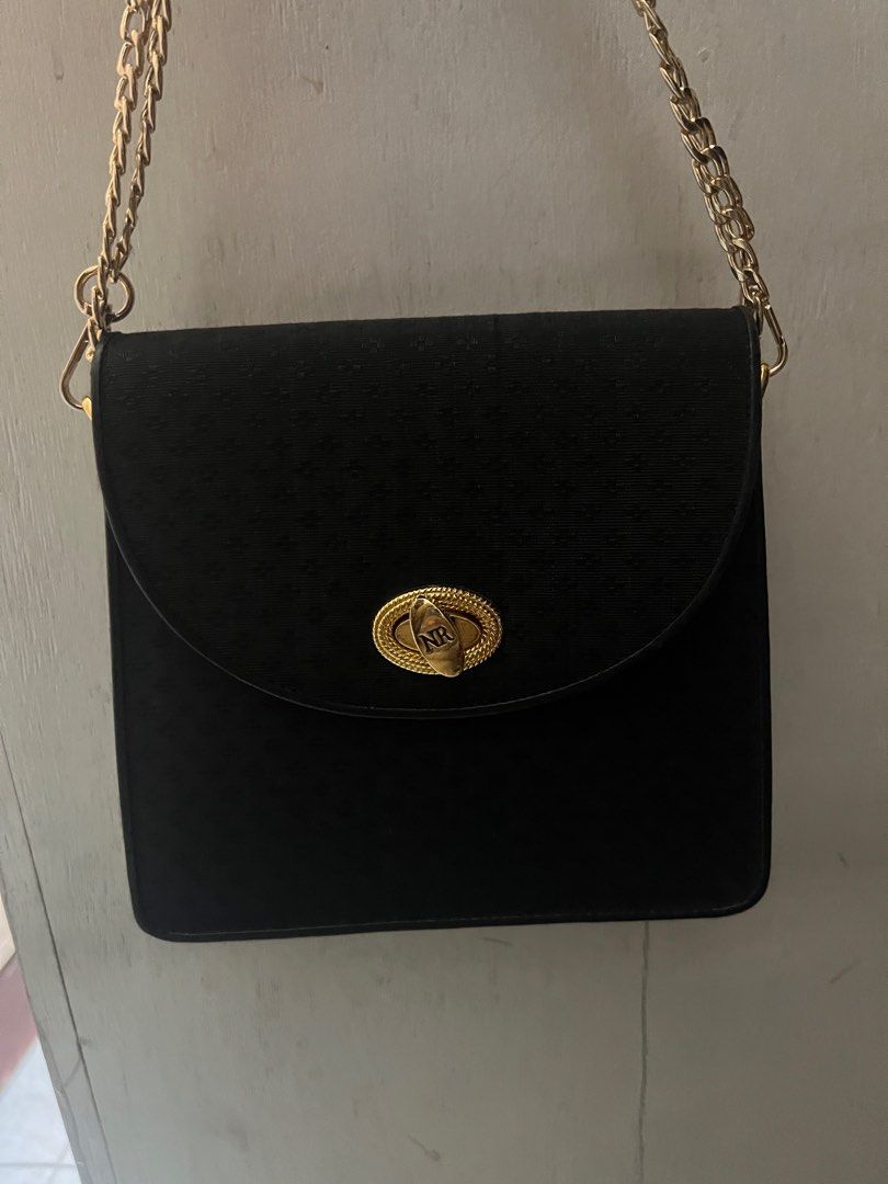 Nina Ricci party bag (Category: Luxury Bags & Wallets) located in Quezon City. Submitted by flamingo28pink (Listing ID 1252141449, Image 3). Description: Bought this online for 2k and never used it. Because walang party na aatenan. This bag is pretty gorgeous and pwede sa wedding and night party looks elegant and very handy phone and purse can fit. Bagay in any outfit lalu n kpag nka pants.