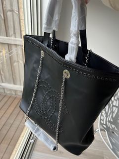 Black eyelet giant shoulder bag