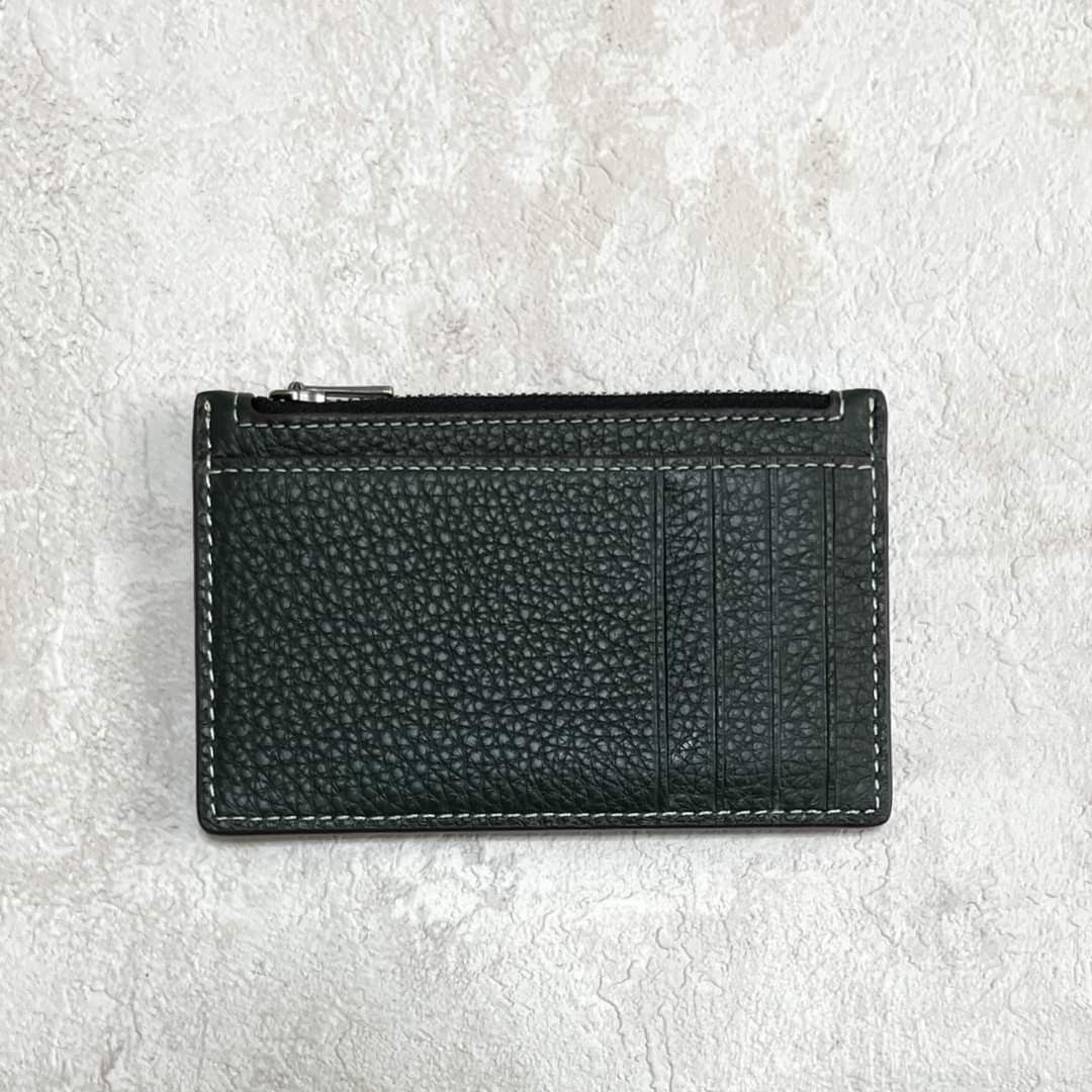 Coach X Peanuts Zip Card Case With Snoopy Motif (Category: Wallets & Card holders) located in Manila. Submitted by stacey_lopez922 (Listing ID 1247018928, Image 3). Description: Coach X Peanuts Zip Card Case With Snoopy Motif (With box and paperbag) - 5" (L) x 3 1/4" (H) - Refined pebble leather - Five credit card slots - Zip pocket.