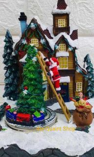 Santa  on a Ladder Christmas Village
