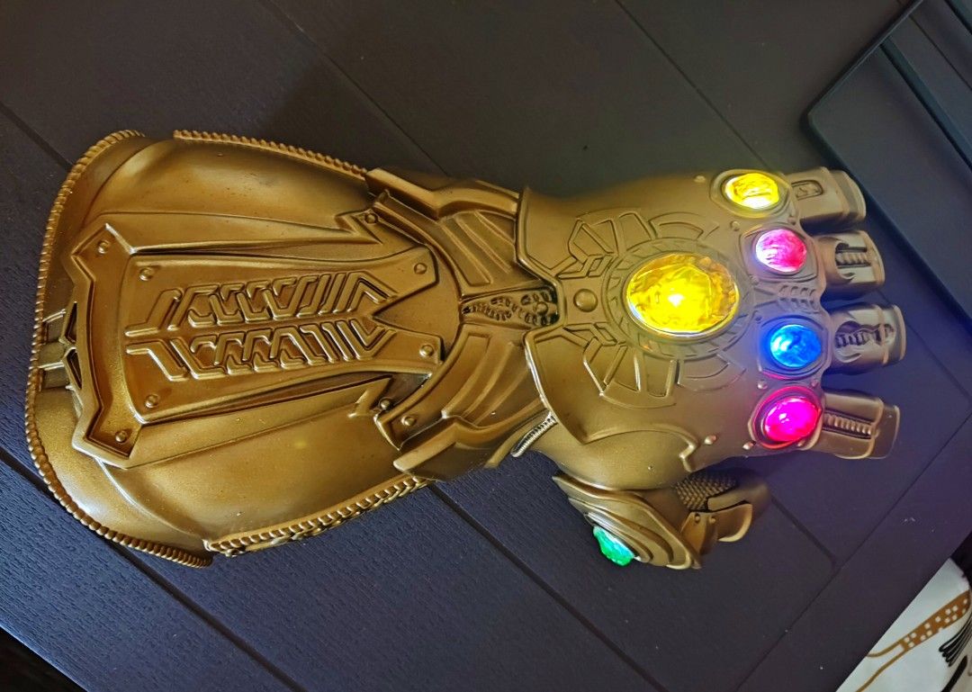 Thanos Infinity Gauntlet Wearable Led Lights on and Off (Category: Western Merchandise) located in Caloocan City. Submitted by guitarsandcosplayph (Listing ID 1246986566, Image 1). Description: Thanos Infinity Gauntlet Gloves Pang Display / Collection / Cosplay Kids and Adult Pwede Price 1500 Brand New Wearable Led Lights on and off.