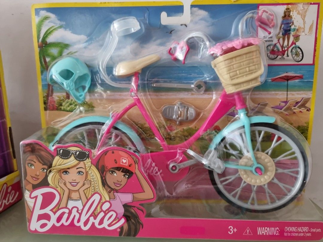 barbie doll with bicycle