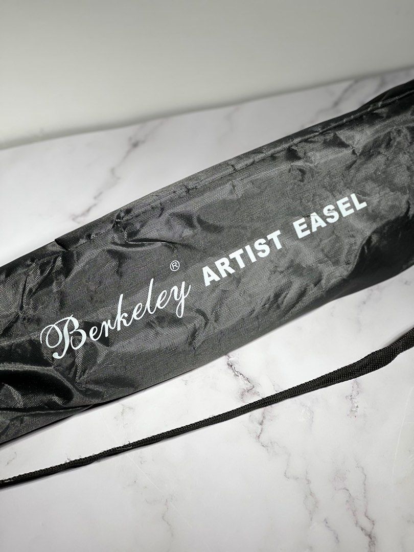 Berkeley Artist Easel stand with Bag | Like New (Category: Tripods & Monopods) located in Makati City. Submitted by KambyoIde (Listing ID 1247156874, Image 1). Description: Selling my 1 time used Easel stand for only P1,499. > Original price is P1,800 > Bought from National Bookstore Glorietta last March 3, 2023 > 1 time used last March for our Concert poster stand. > RFS: di na magamit and need funds for my Mother’s hospital bills :( Feel free t