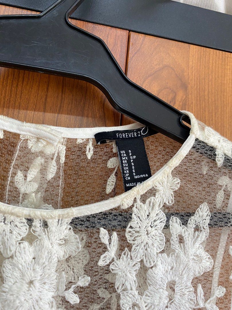Forever 21 Lace Top (Category: Blouses) located in Las Pinas. Submitted by milkydeclutter (Listing ID 1247210602, Image 3). Description: - Original Forever 21 - Lace material - with some yellowish discoloration on neckline but still usable - size: small MOP: BPI, gcash, shopee COD (with additional 5 pesos for shopee transaction fee) MOD: grab/lalamove, shopee.