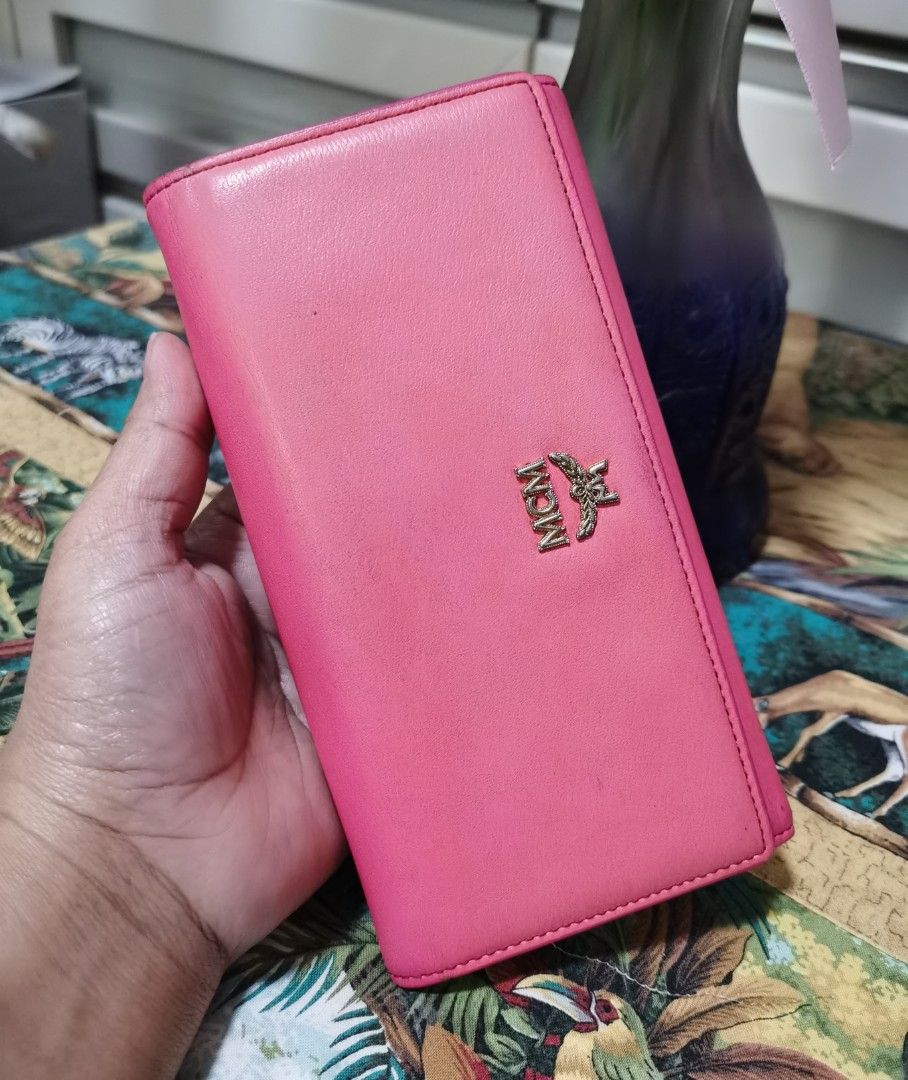 💯MCM Trifold Long Wallet (Category: Luxury Bags & Wallets) located in Cainta. Submitted by phengaying (Listing ID 1247282381, Image 3). Description: Original MCM Trifold Long Wallet | Genuine Leather | 10 Card-Slots | Paper Bill Compartments | Preowned in 8/10 Condition Flaw/s: Minor discoloration, faded Hardware, cracks on rubbing lining.