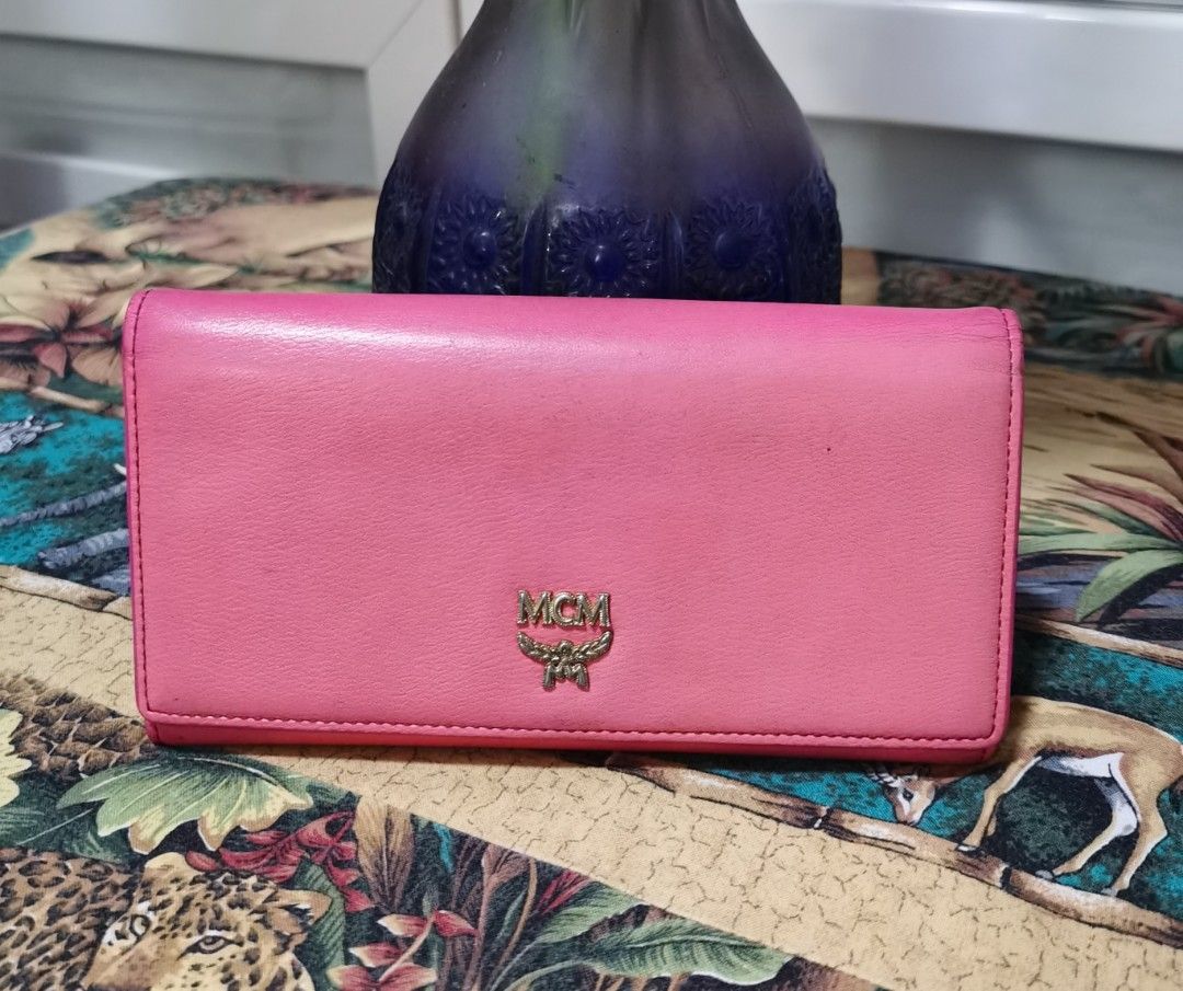 💯MCM Trifold Long Wallet (Category: Luxury Bags & Wallets) located in Cainta. Submitted by phengaying (Listing ID 1247282381, Image 1). Description: Original MCM Trifold Long Wallet | Genuine Leather | 10 Card-Slots | Paper Bill Compartments | Preowned in 8/10 Condition Flaw/s: Minor discoloration, faded Hardware, cracks on rubbing lining.