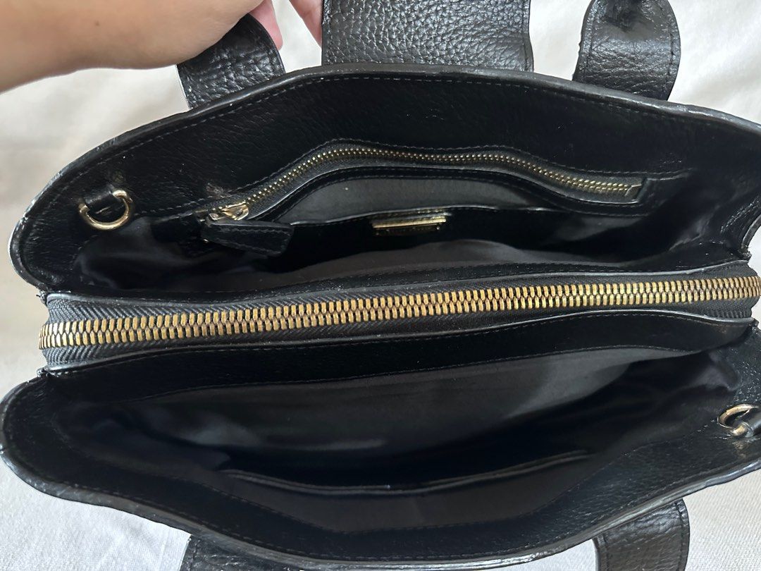 Preloved Authentic Miu Miu Leather Bag (Category: Luxury Bags & Wallets) located in Santa Rosa. Submitted by Busy_Momma (Listing ID 1247164620, Image 3). Description: Authentic Flaws: Missing Sling Missing Zipper Puller Back Zipper pocket Rubs on piping Needs Bag Shaper.