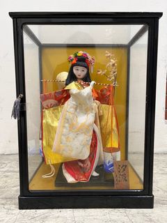 Chinese doll in glass case deals