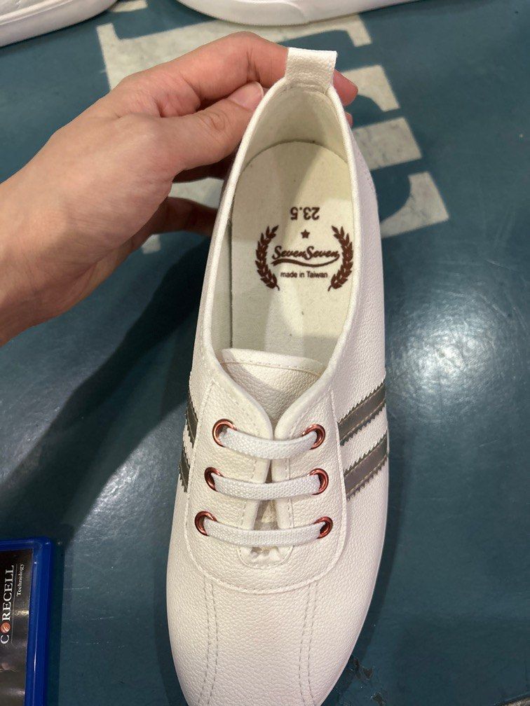White shoes top with gold stripes