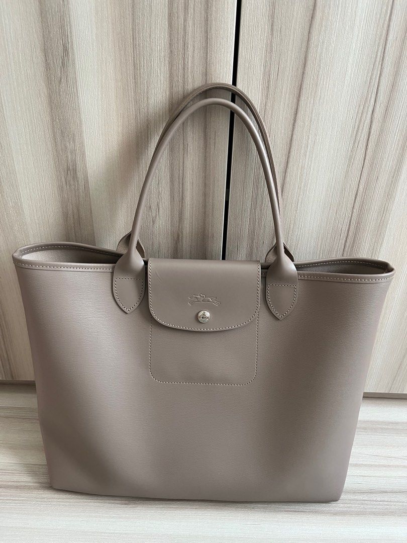 This color is Taupe! Le Pliage Coated canvas city pouch. Dm to