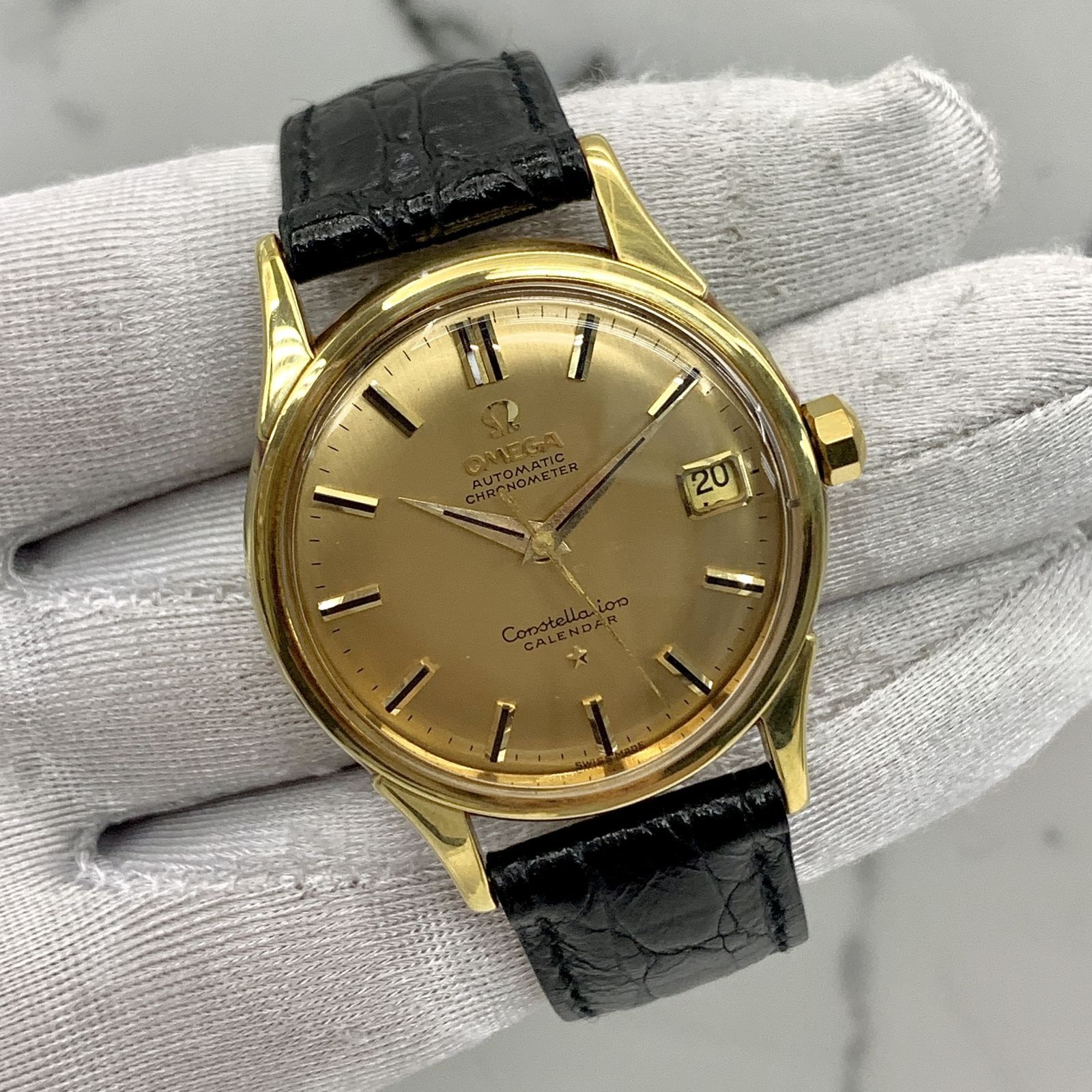 Gold omega sale mens watch