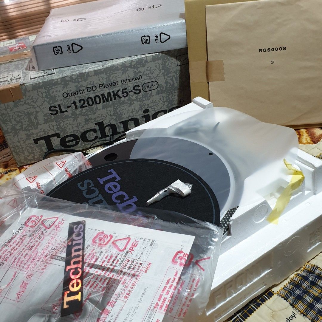 Technics SL-1200 MK5 Turntable Direct Drive (Category: Soundbars, Speakers & Amplifiers) located in Manila. Submitted by racz03 (Listing ID 1247369299, Image 2). Description: Technics SL-1200MK5 Turntable, Direct Drive with Box. Good As Brand New. Almost Un Used Condition. No Noticeable Scratches. With unused Slip mat, Sealed Rubber Mat, Plastic mat, Technics alignment Gauge, Technics Sticker, Sub Counter Weight, Manual and Unused Dust Cover.