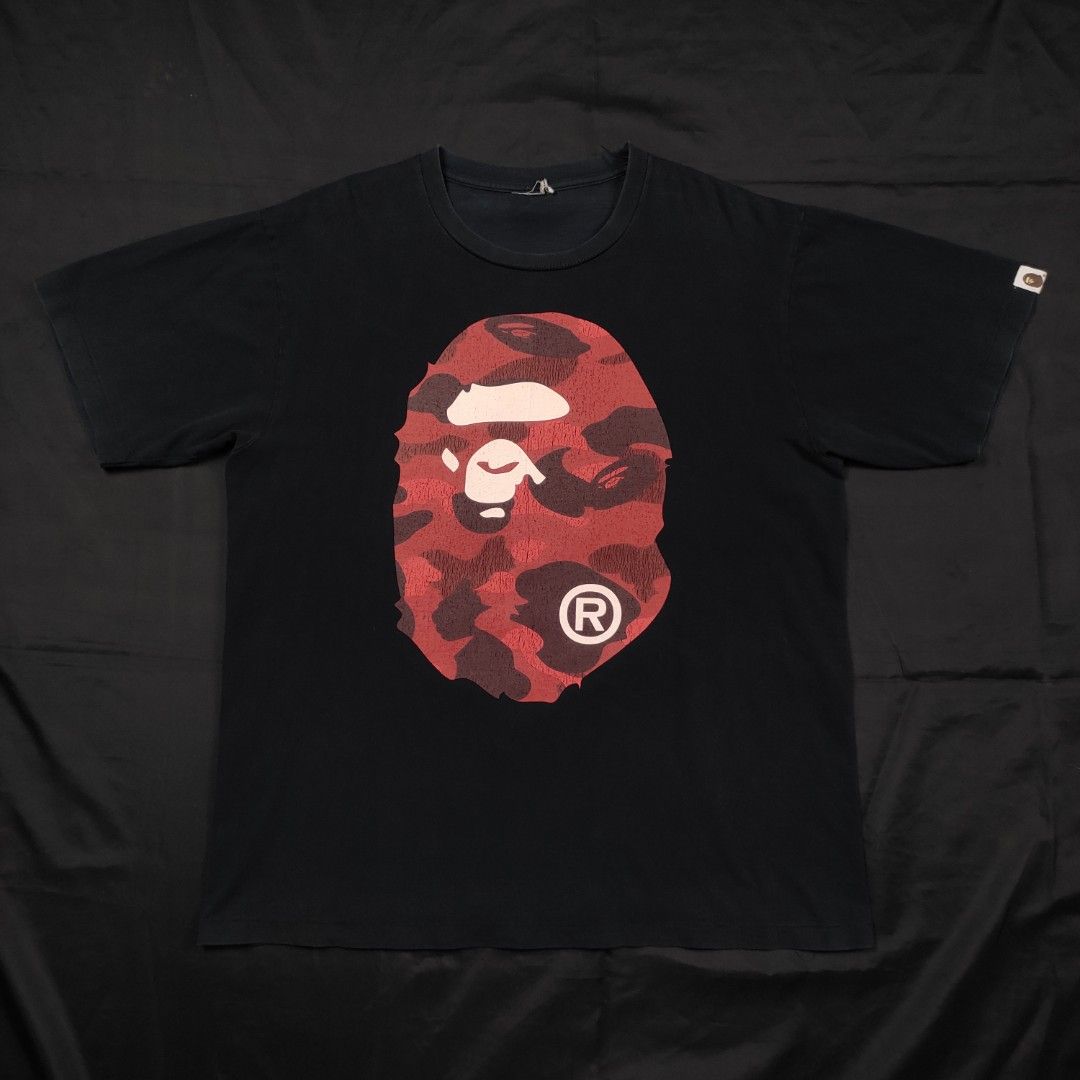 BAPE BIGHEAD RED CAMOU SHIRT (Category: Tshirts & Polo Shirts ) located in Quezon City. Submitted by cyborgph (Listing ID 1247564540, Image 2). Description: BAPE BIG HEAD RED CAMOU SHIRT 22*27 in good condition issue: good fade, crack prints and cut tag.