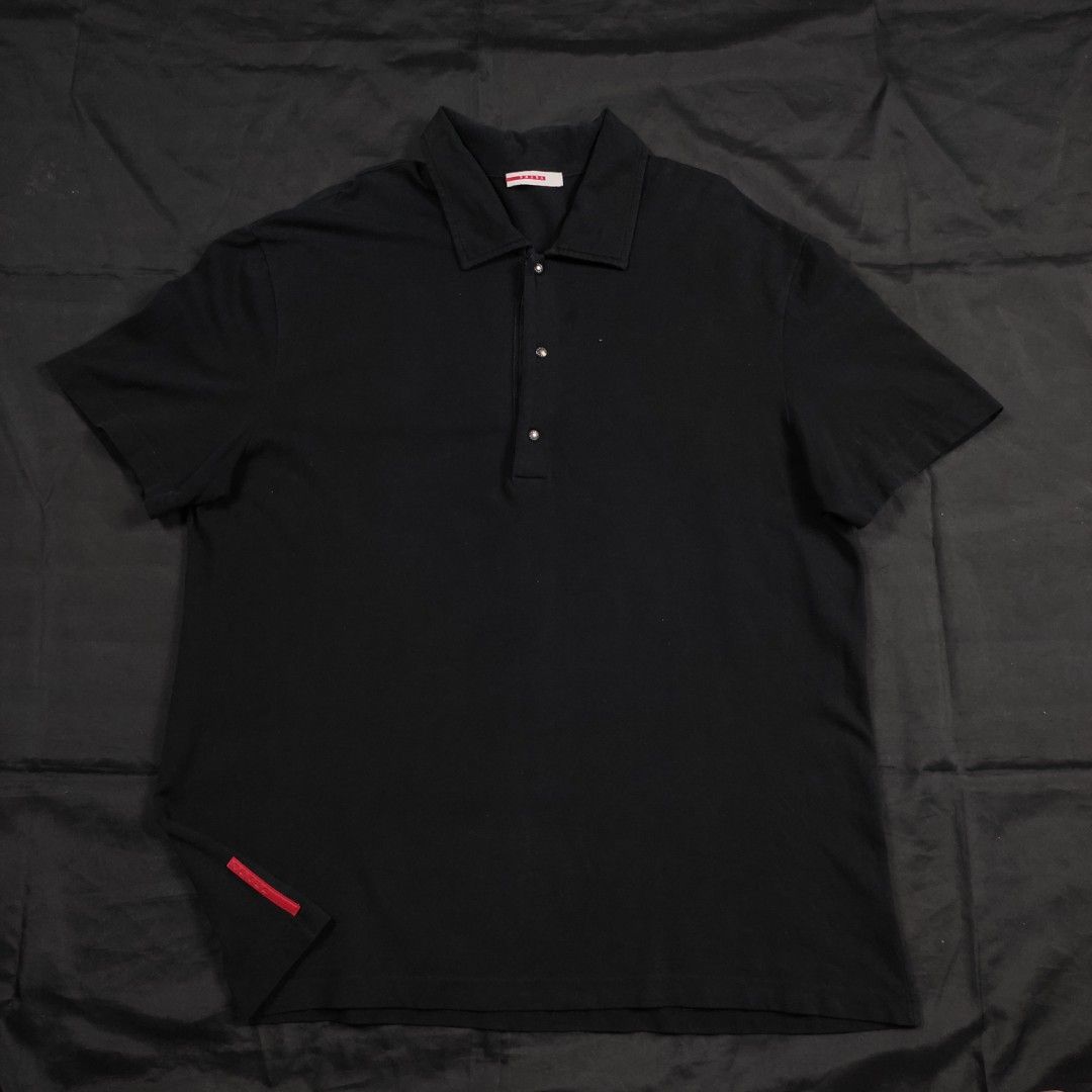 PRADA - red tab polo shirt (Category: Tshirts & Polo Shirts ) located in Quezon City. Submitted by cyborgph (Listing ID 1247554333, Image 2). Description: PRADA RED TAB POLO SHIRT xl IN GOOD CONDITION issue: pinhole front and back unnoticeable can send more photos if needed.